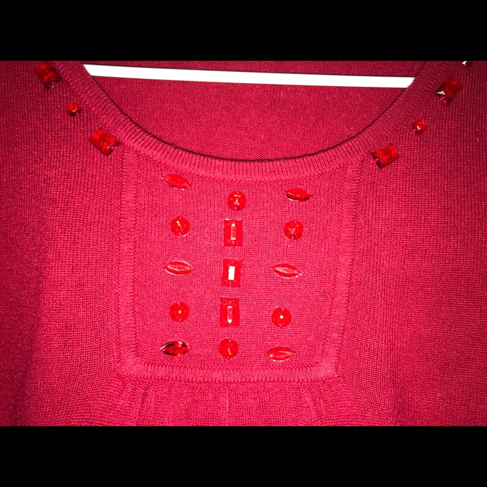 Red sweater with jewels accents